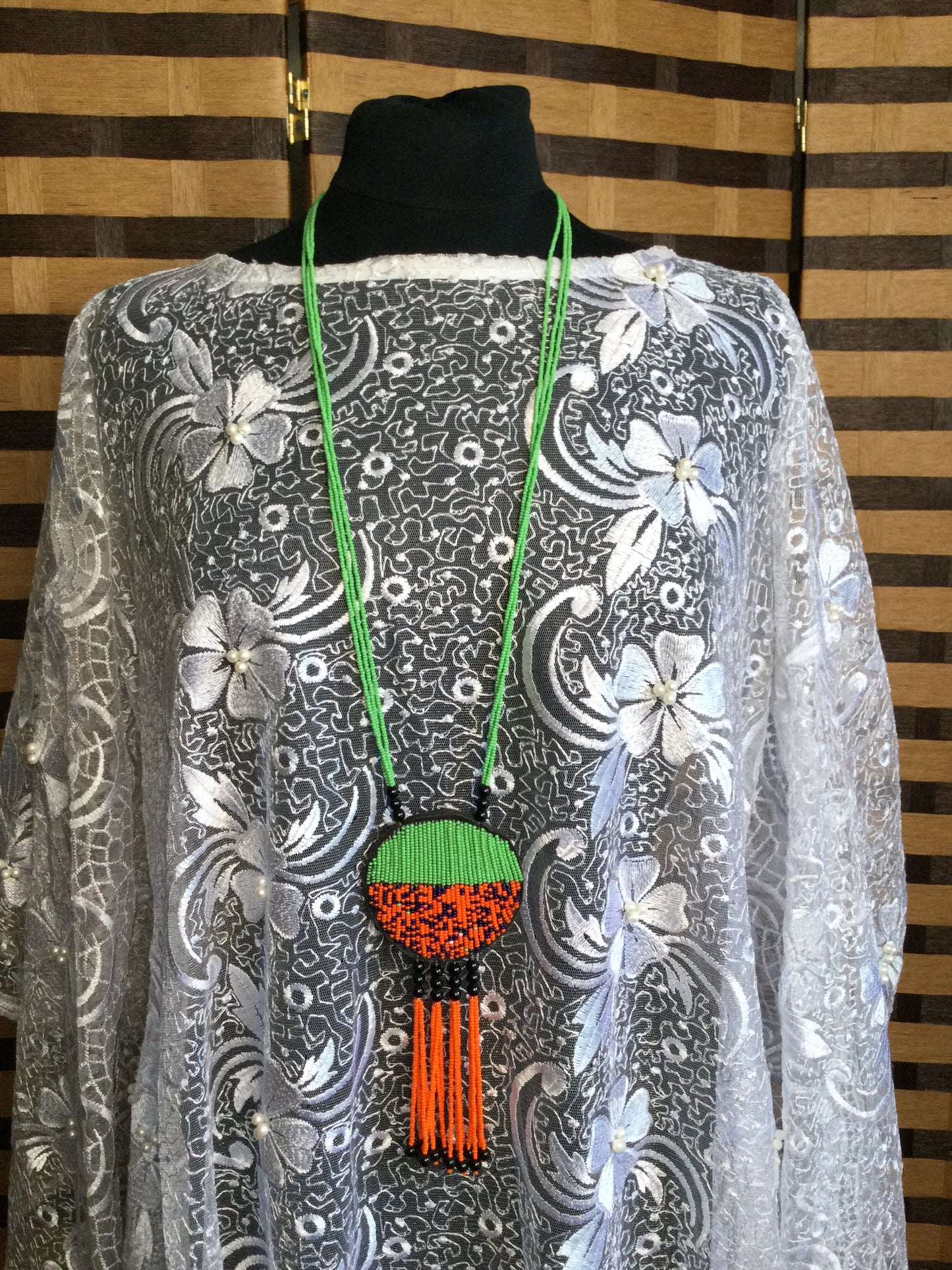 Long Strand beaded necklace with leather and beads pendant