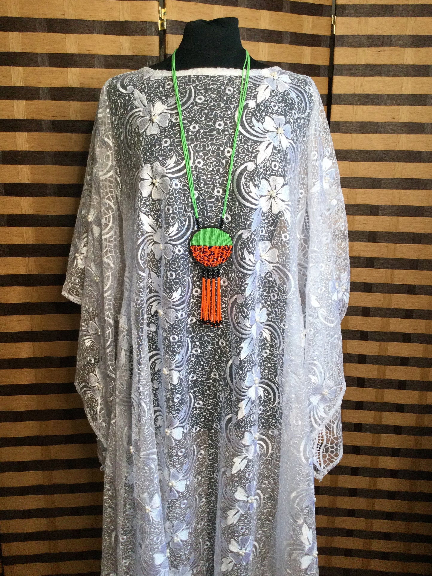 Long Strand beaded necklace with leather and beads pendant