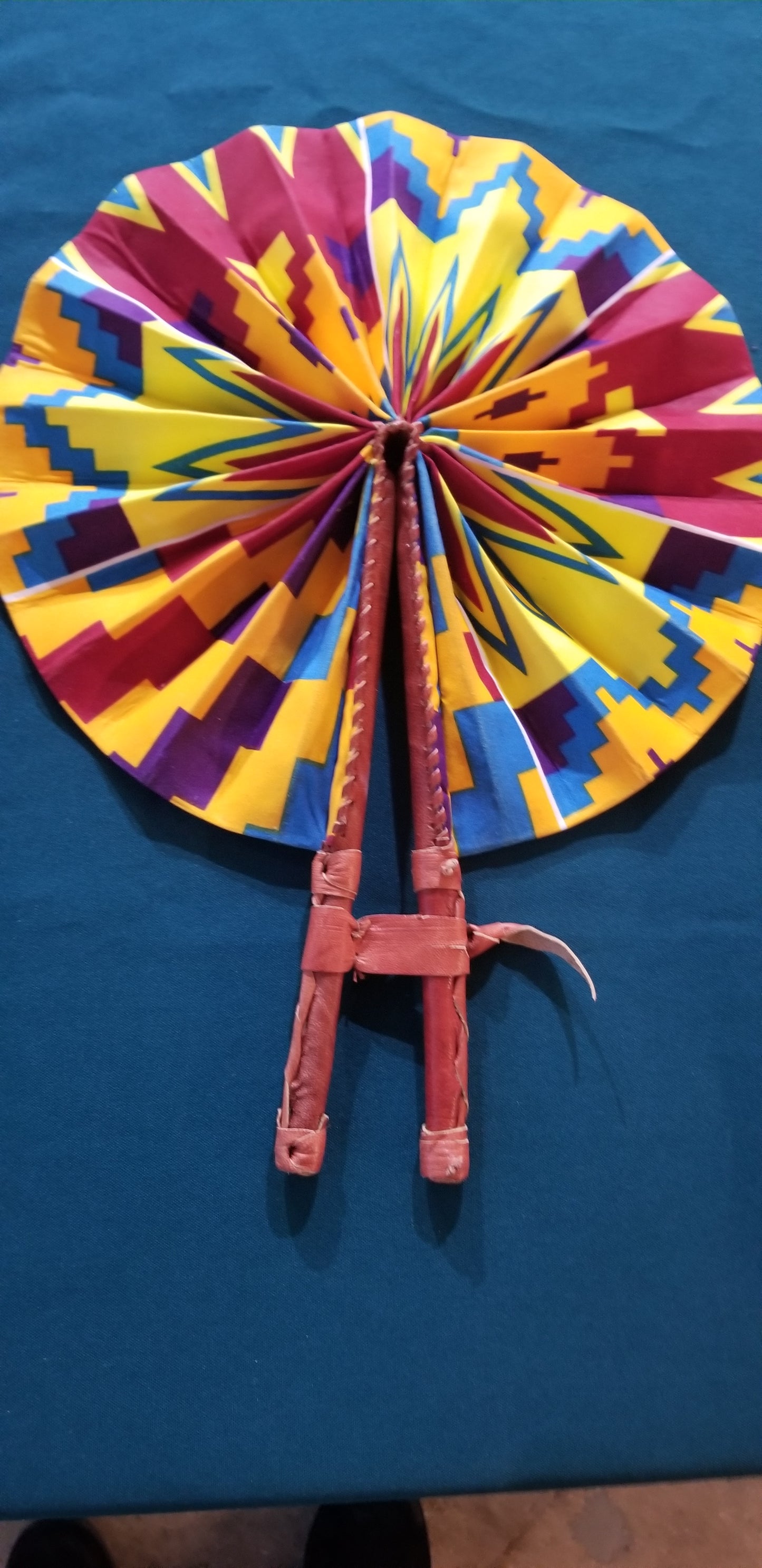 Hand held fan crafted with Delightfully bright African print