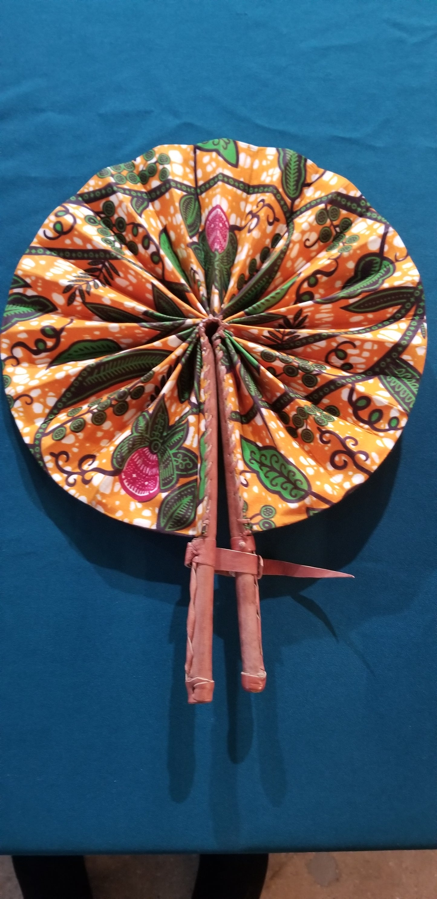 Hand held fan crafted with Delightfully bright African print