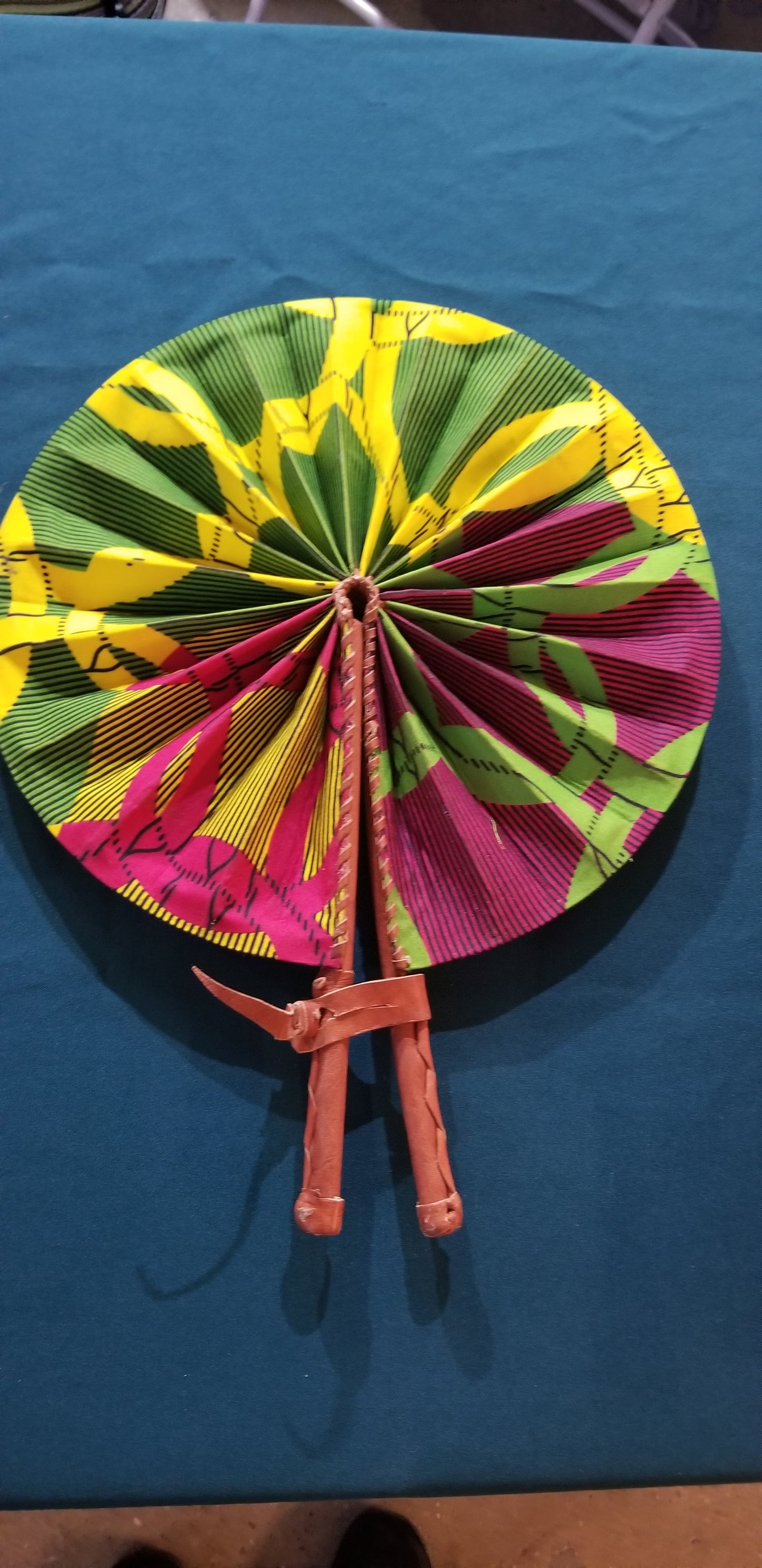 Hand held fan crafted with Delightfully bright African print