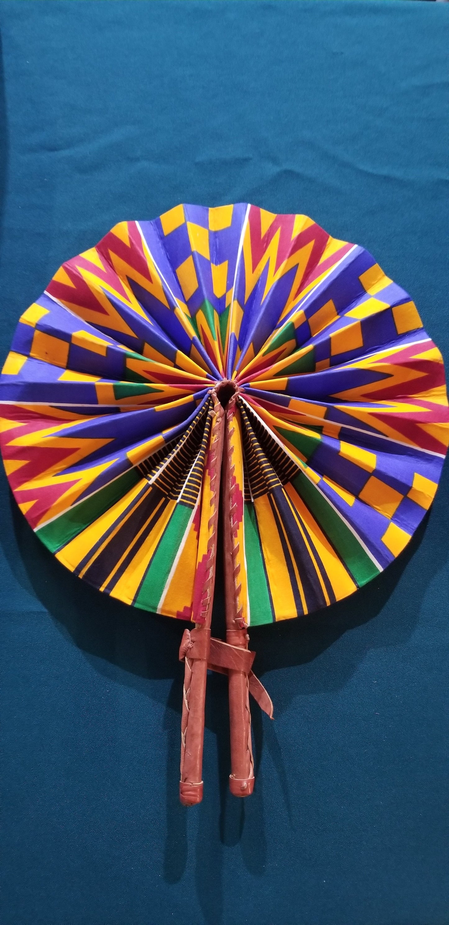 Hand held fan crafted with Delightfully bright African print