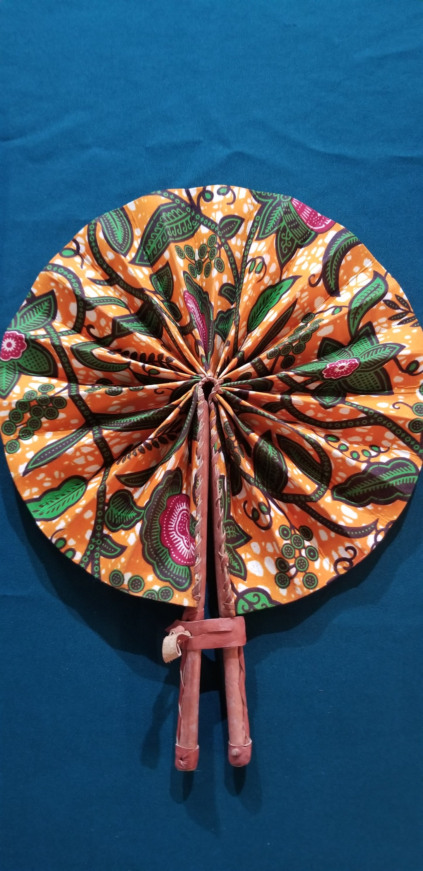 Hand held fan crafted with Delightfully bright African print