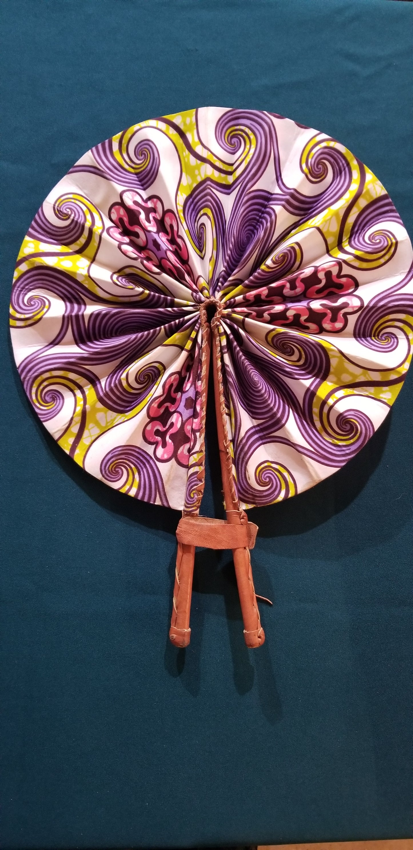 Hand held fan crafted with Delightfully bright African print