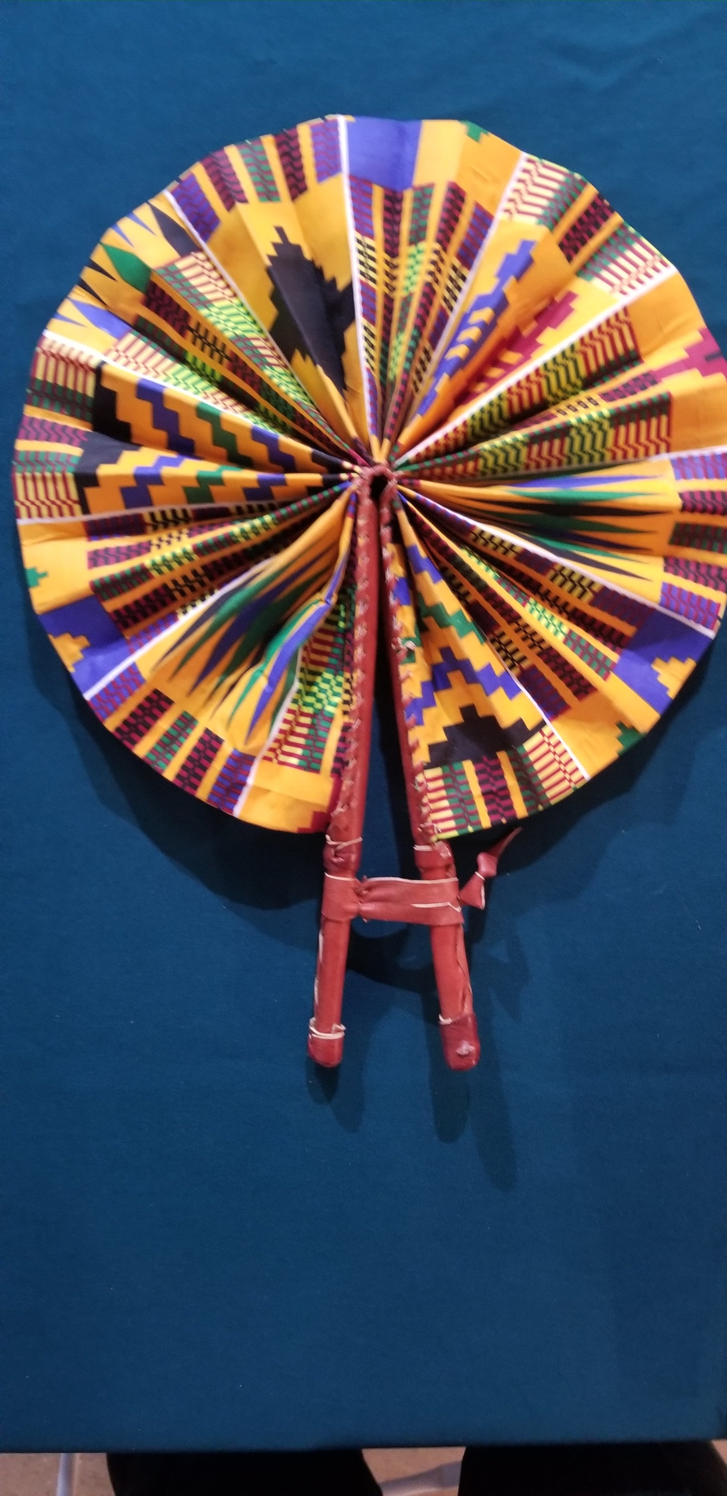Hand held fan crafted with Delightfully bright African print