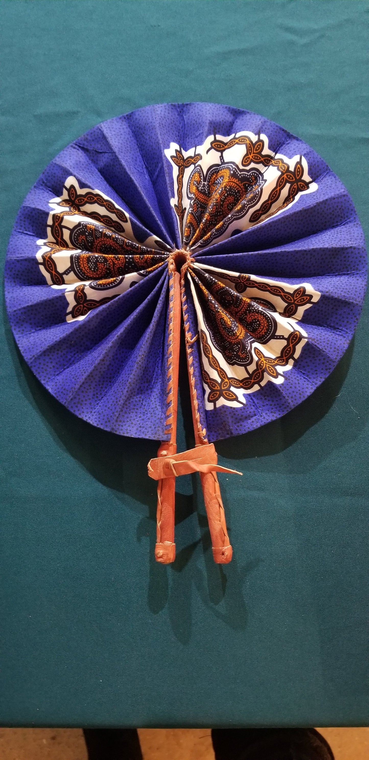 Hand held fan crafted with Delightfully bright African print