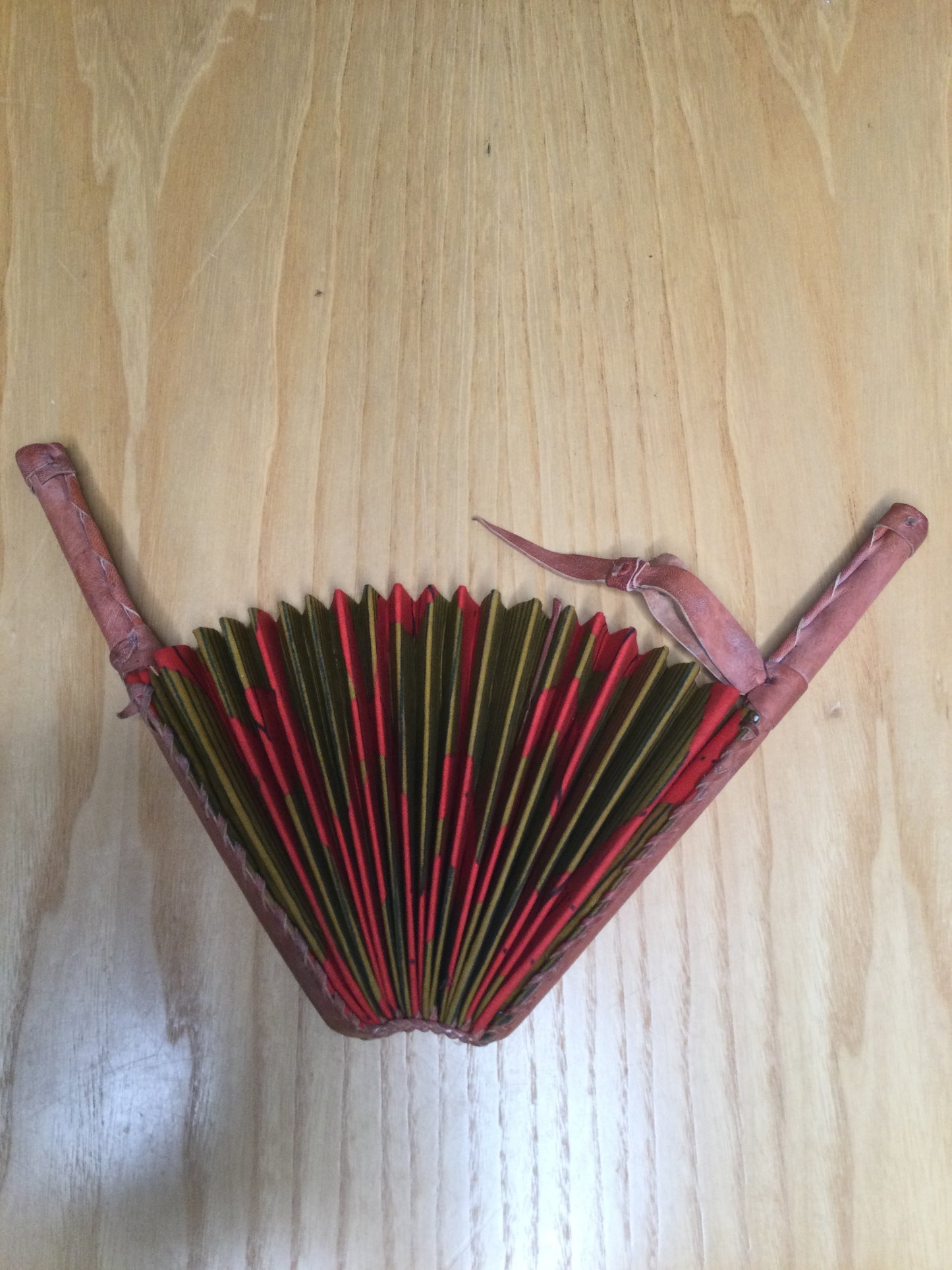 Hand held fan crafted with Delightfully bright African print