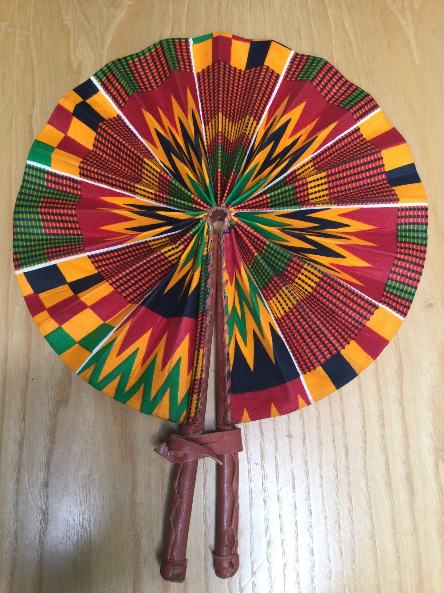 Hand held fan crafted with Delightfully bright African print
