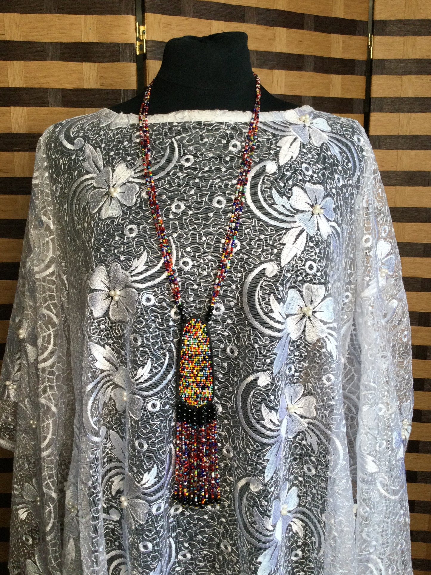 Long Strand beaded necklace with leather and beads pendant