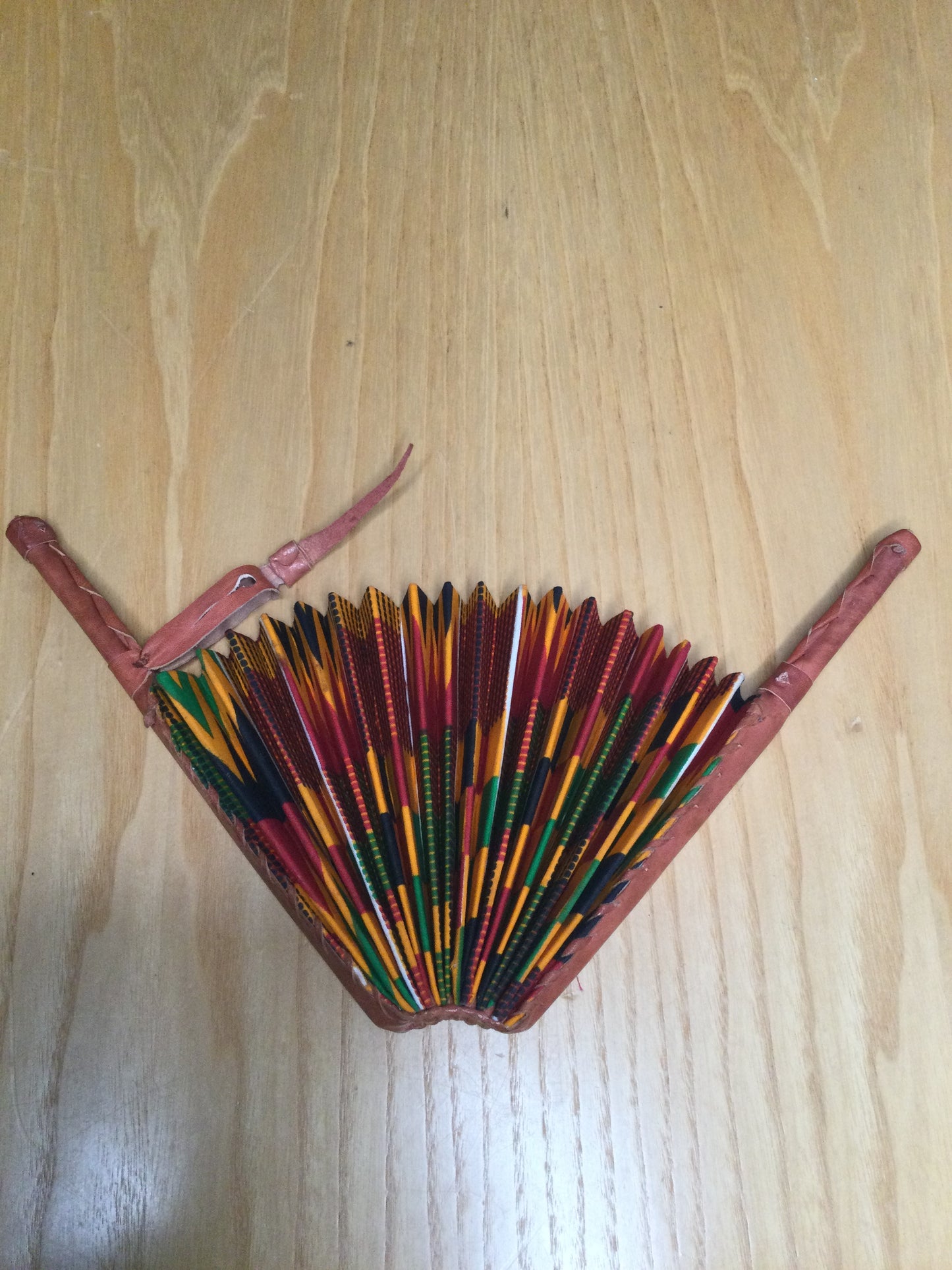 Hand held fan crafted with Delightfully bright African print