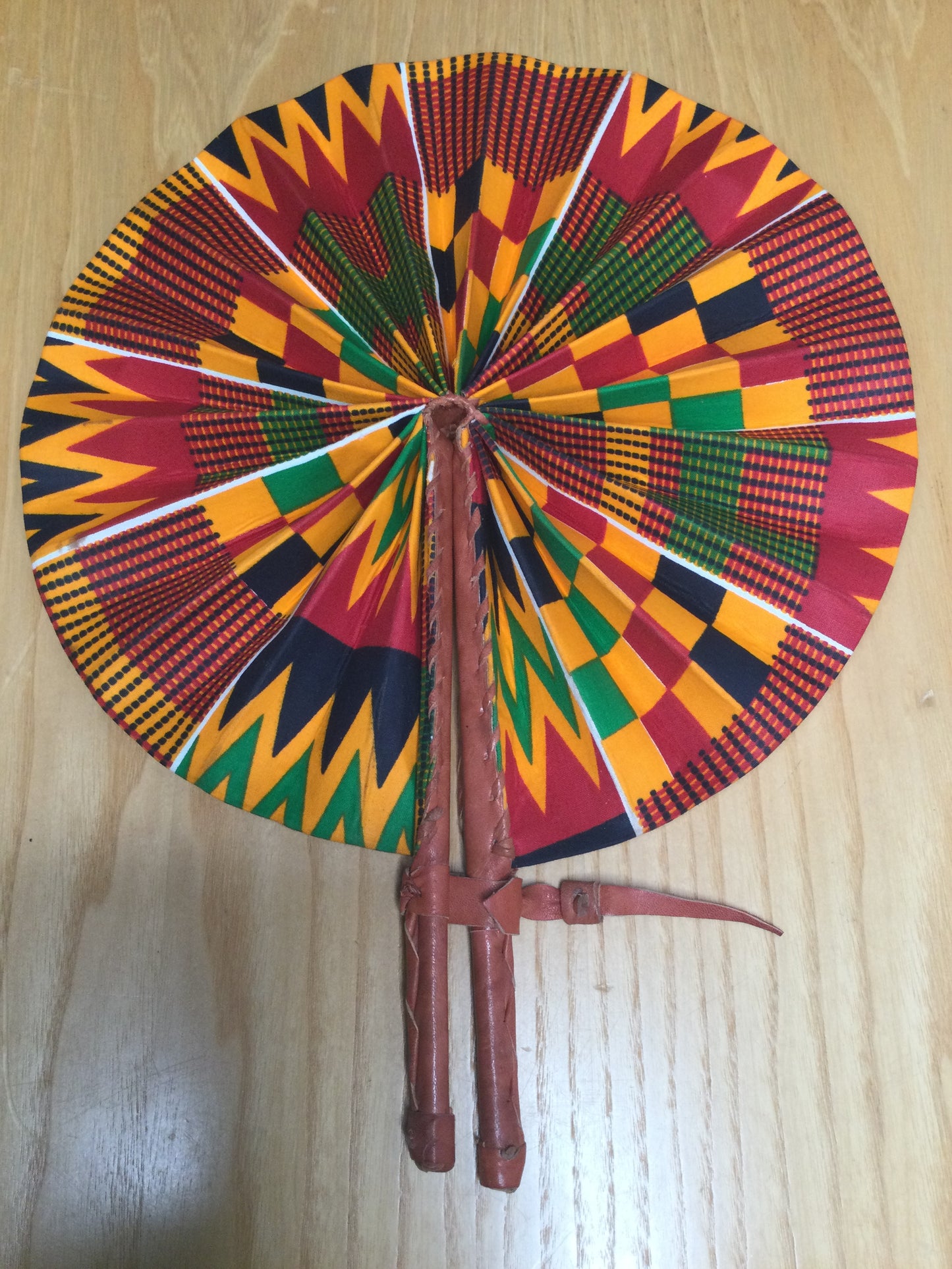 Hand held fan crafted with Delightfully bright African print