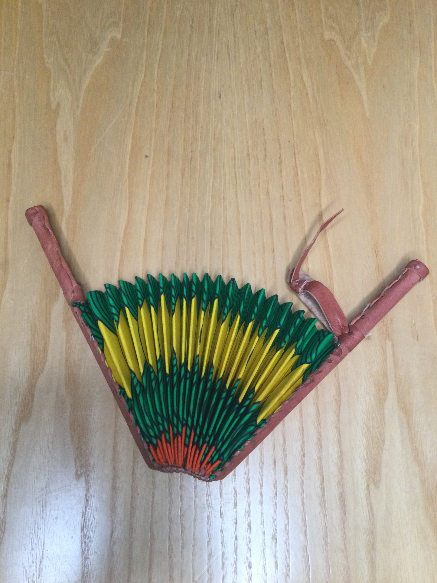 Hand held fan crafted with Delightfully bright African print