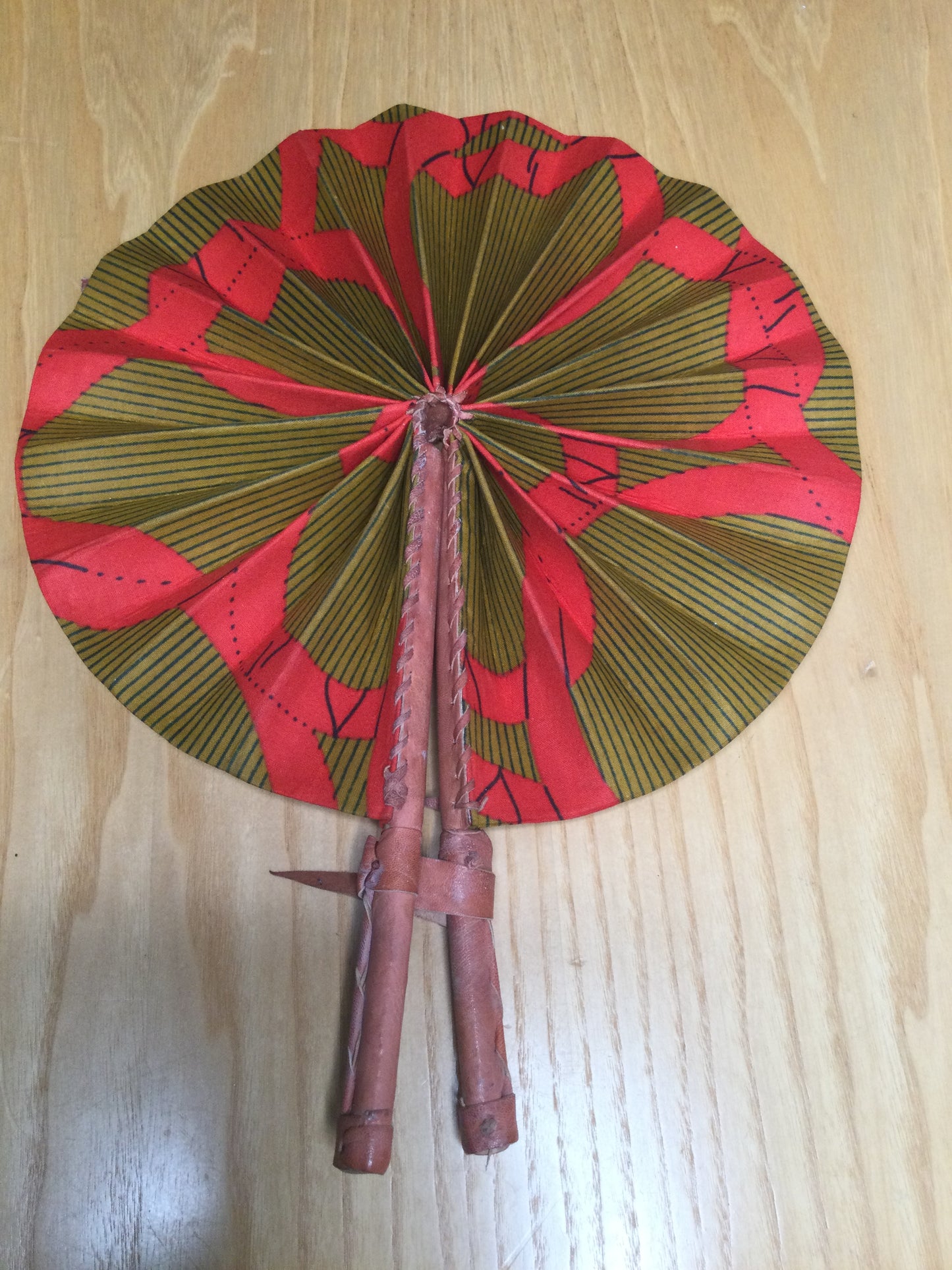 Hand held fan crafted with Delightfully bright African print