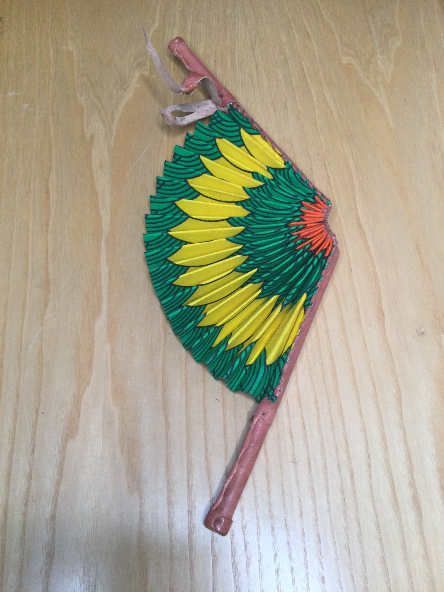 Hand held fan crafted with Delightfully bright African print