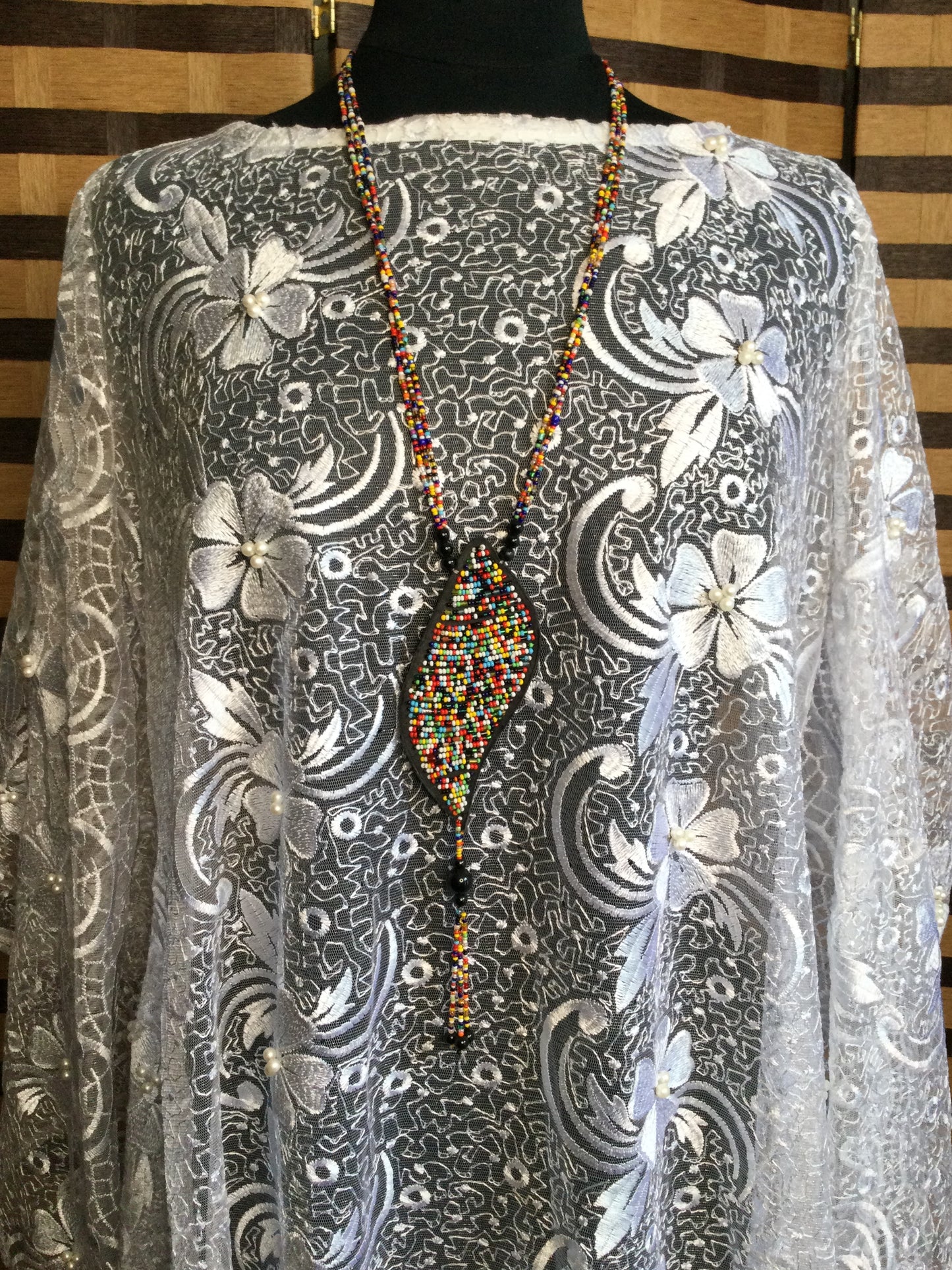 Long Strand beaded necklace with leather and beads pendant