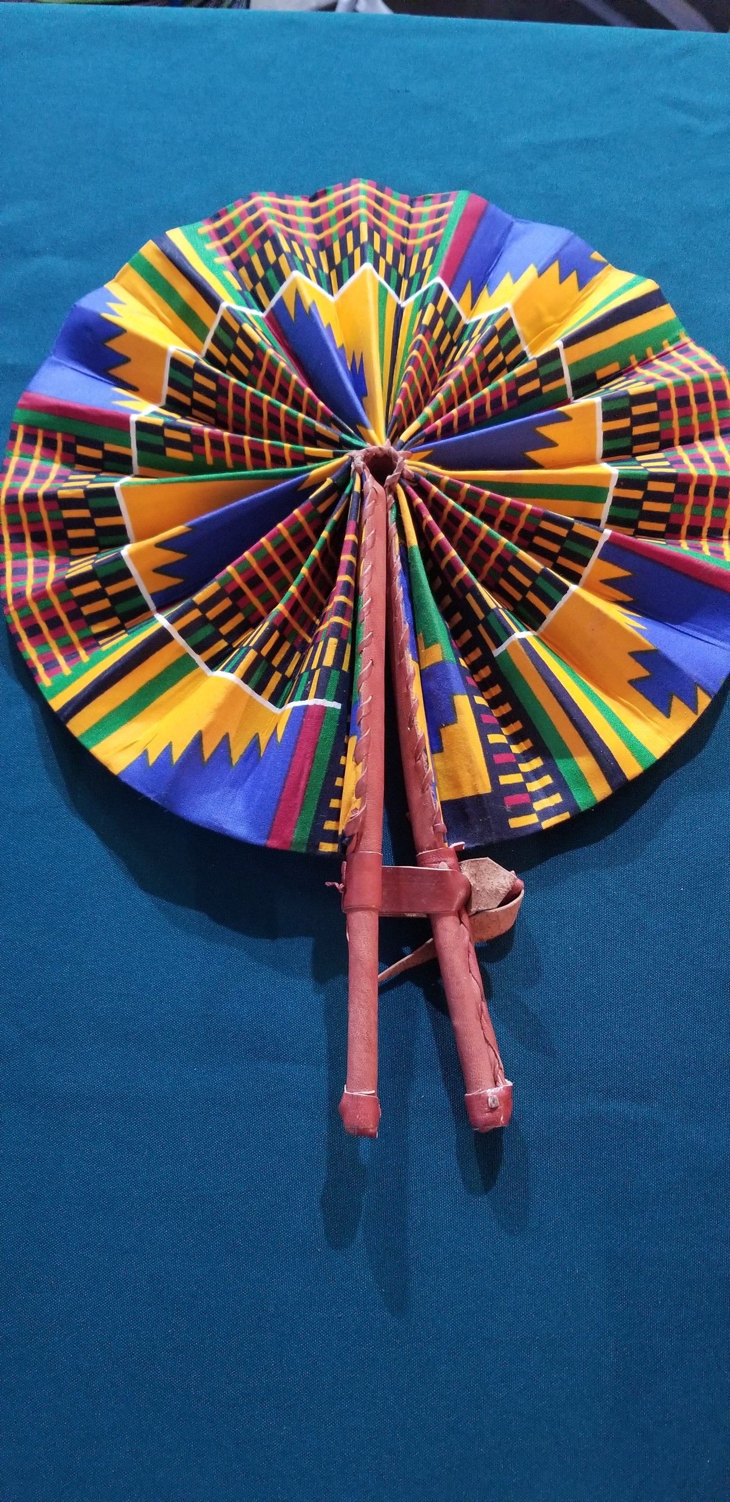 Hand held fan crafted with Delightfully bright African print