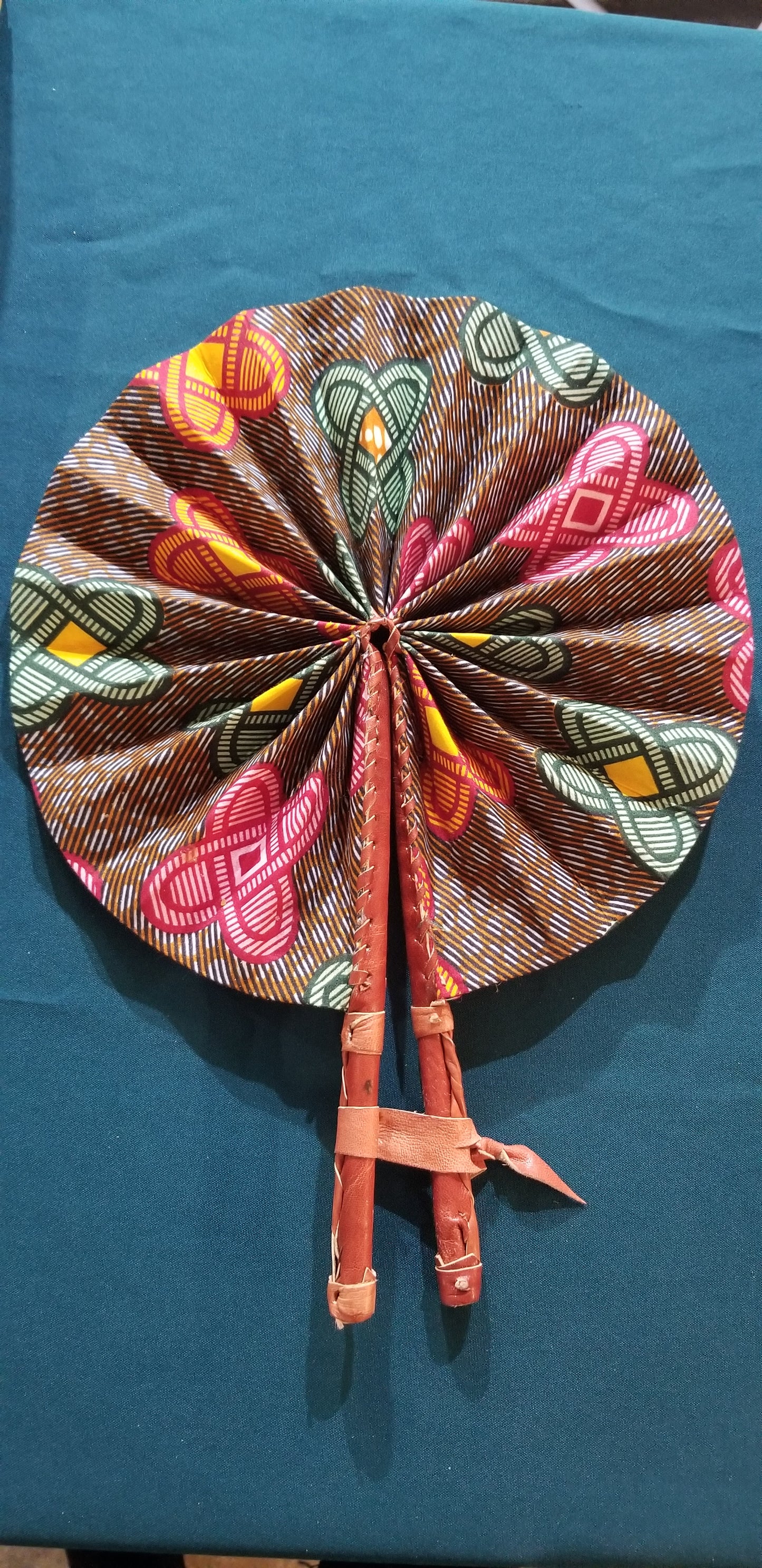 Hand held fan crafted with Delightfully bright African print