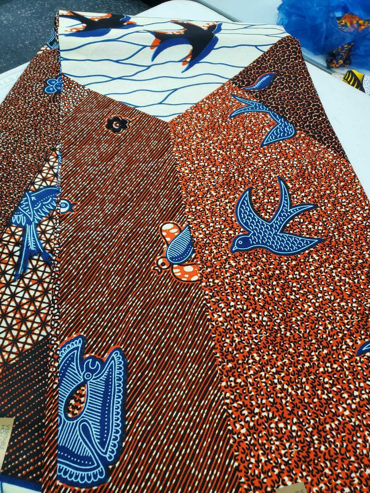 Burnt Orange Multi African Print with assorted motif 100% Cotton $7 per yard