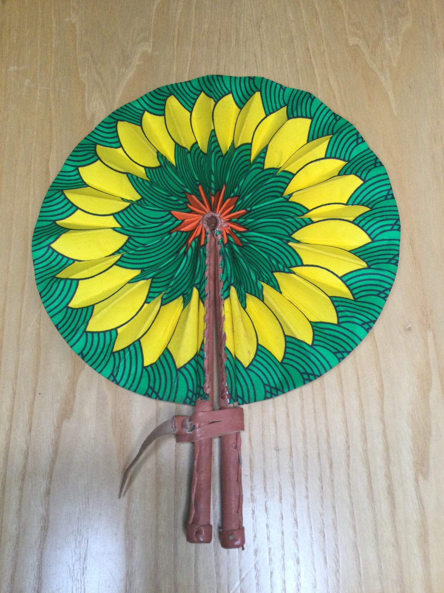 Hand held fan crafted with Delightfully bright African print